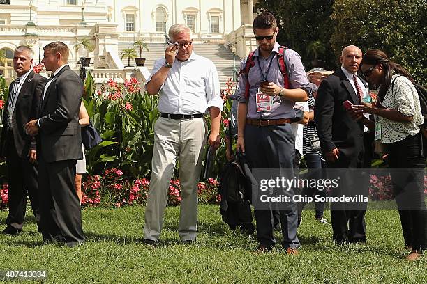 Conservative pundit Glenn Beck is surrounded by staff and private security guards as he prepares to take the stage during a rally against the Iran...