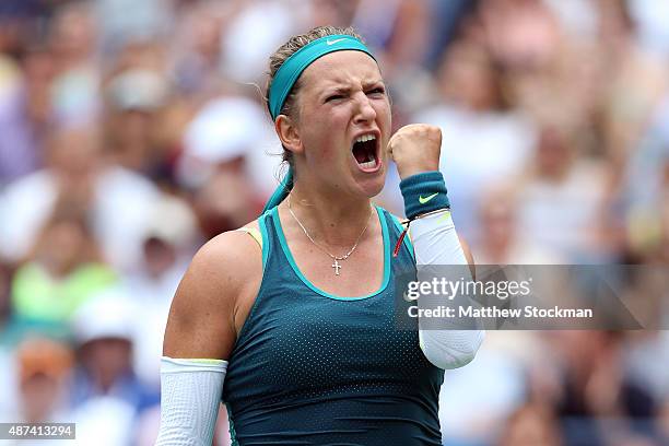 Victoria Azarenka of Belarus celebrates after winning the second set against Simona Halep of Romania during their Women's Singles Quarterfinals match...