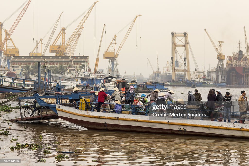 Ferry platform with people in industrial harbour