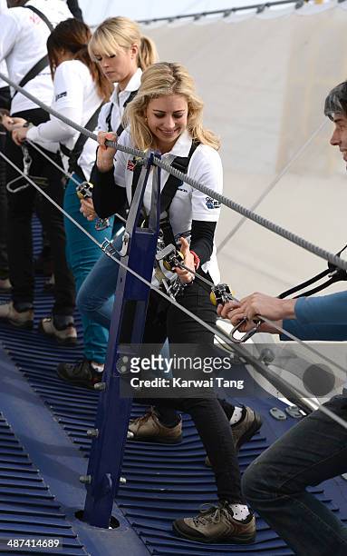 Isabella Calthorpe and Holly Branson scale the 02 Arena during a photocall to launch the Virgin STRIVE Challenge held at the 02 Arena on April 30,...
