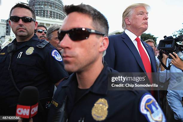 Republican presidential candidate Donald Trump prepares to take the stage during a rally against the Iran nuclear deal on the West Lawn of the U.S....