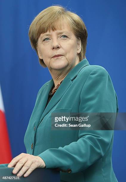 German Chancellor Angela Merkel and Japanese Prime Minister Shinzo Abe speak to the media following talks at the Chancellery on April 30, 2014 in...