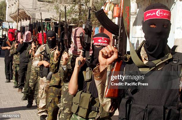 Palestinian militants from the Popular Front for the Liberation of Palestine stage a parade in Khan Yunis in the southern Gaza Strip.