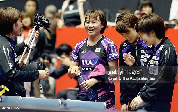Sayaka Hirano, Yuka Ishigaki and Kasumi Ishikawa of Japan celebrate winning against Chinese Taipei during day three of the 2014 World Team Table...