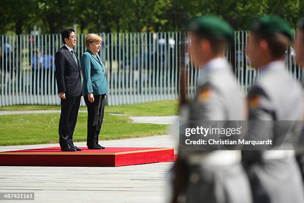 German Chancellor Angela Merkel welcomes the Japanese Prime Minister Shinzo Abe at the Chancellory on April 30, 2014 in Berlin, Germany. The two...