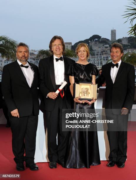 Producers Luc Besson, Bill Pohlad, Dede Gardner and Grant Hill pose during a photocall after receiving on behalf of US director Terrence Malick the...