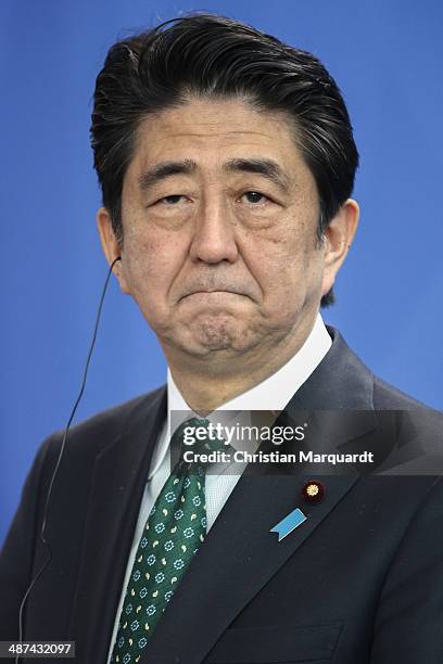 Japanese Prime Minister Shinzo Abe speaks to the media following talks at the Chancellery with German Chancellor Angela Merkel on April 30, 2014 in...