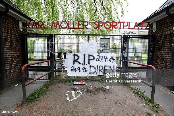 Tributes are left in memory of Diren Dede outside his local football club, SC Teutonia 1910, on April 30, 2014 in Hamburg, Altona, Germany. German...