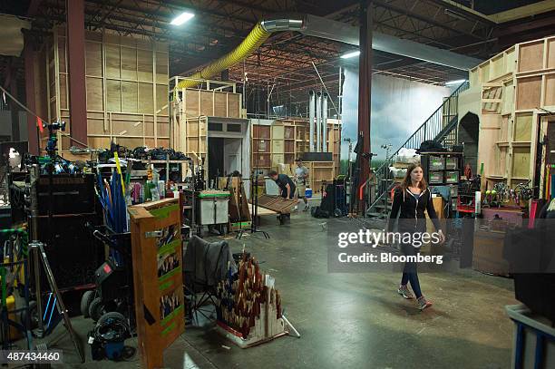 Crew moves equipment backstage for the television show "Reign" at Cinespace Film Studios in Toronto, Ontario, Canada, on Thursday, Aug. 27, 2015....