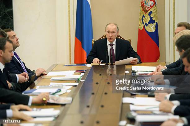 Russian President Vladimir Putin speaks at a meeting with the Prime Minister and Cabinet members at the Kremlin on April 30, 2014 in Moscow,Russia.