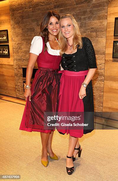 Karen Webb and Christina Surer wearing a Lodenfrey Dirndl during a cocktail reception hosted by Lodenfrey and Baume & Mercier to present the limited...