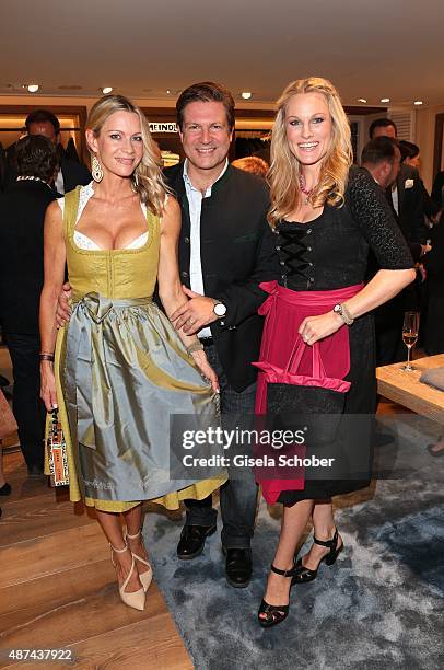 Francis Fulton Smith and his wife Verena Klein and Christina Surer during a cocktail reception hosted by Lodenfrey and Baume & Mercier to present the...