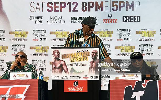 Boxer Floyd Mayweather Jr., his father and trainer Floyd Mayweather Sr. And boxer Andre Berto attend a news conference at MGM Grand Hotel & Casino on...