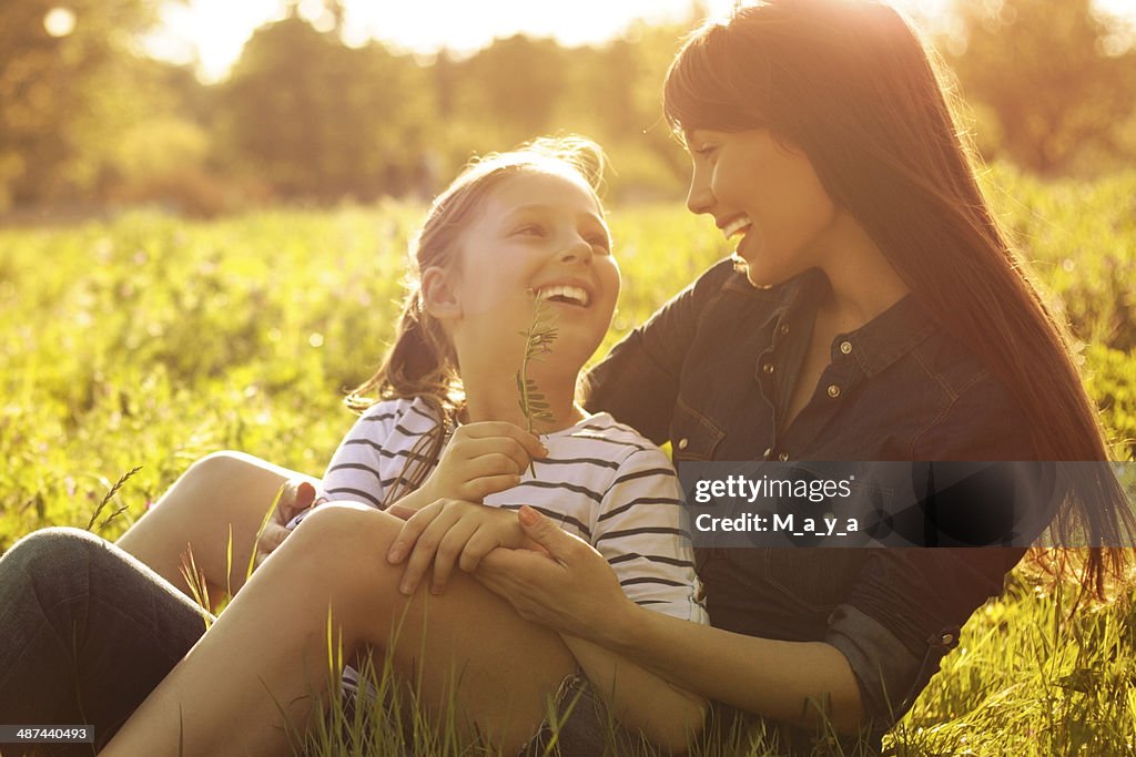 Woman with her daughter enjoying the sun.