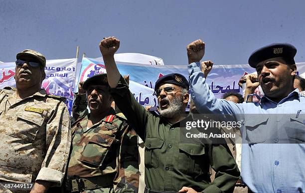 Yemeni Labor Unions' member walk towards Yemeni Parliement building from the Tahrir Square ahead of the International Workers Day in Sanaa, Yemen, on...