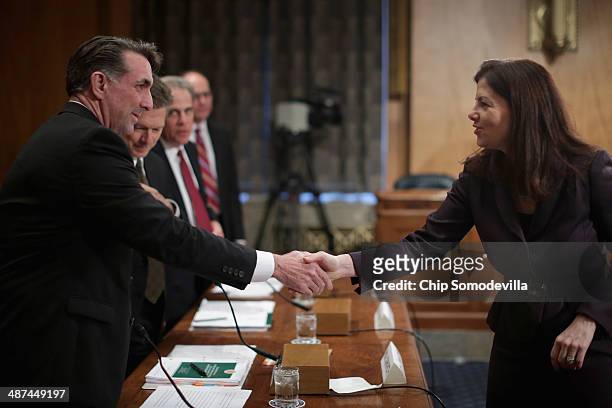 Senate Homeland Security and Governmental Affairs Committee member Sen. Kelly Ayotte greets National Intelligence Community Inspector General Charles...