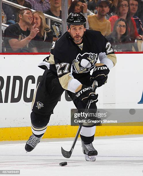 Craig Adams of the Pittsburgh Penguins moves the puck against the Columbus Blue Jackets in Game Five of the First Round of the 2014 Stanley Cup...