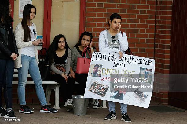 People leave tributes to Diren Dede at his football club, SC Teutonia 1910, on April 30, 2014 in Hamburg, Germany. German student Diven was fatally...