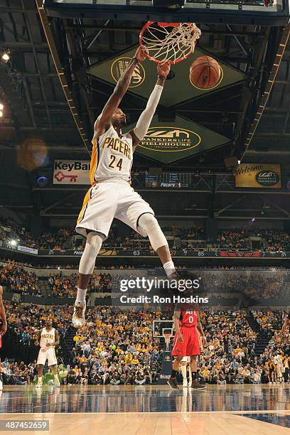 Paul George of the Indiana Pacers dunks the ball against the Atlanta Hawks in Game Five of the Eastern Conference Quarterfinals at Bankers Life...