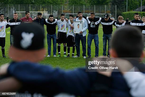 Team-mates, friends and relatives gather to remember Diren Dede at his football club, SC Teutonia 1910, on April 30, 2014 in Hamburg, Germany. German...