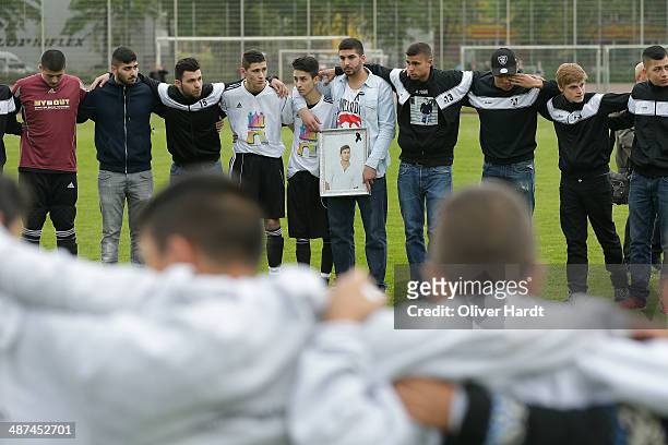 Team-mates, friends and relatives gather to remember Diren Dede at his football club, SC Teutonia 1910, on April 30, 2014 in Hamburg, Germany. German...