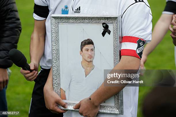 Team-mates, friends and relatives gather to remember Diren Dede at his football club, SC Teutonia 1910, on April 30, 2014 in Hamburg, Germany. German...