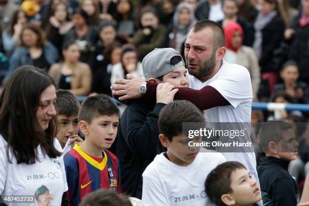 Team-mates, friends and relatives gather to remember Diren Dede at his football club, SC Teutonia 1910, on April 30, 2014 in Hamburg, Germany. German...