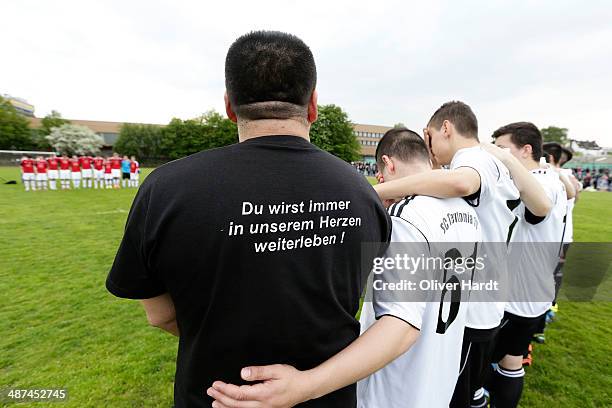 Team-mates, friends and relatives gather to remember Diren Dede at his football club, SC Teutonia 1910, on April 30, 2014 in Hamburg, Germany. German...