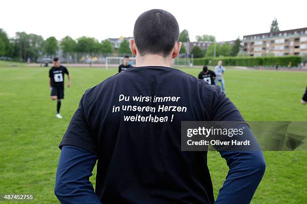 Team-mates, friends and relatives gather to remember Diren Dede at his football club, SC Teutonia 1910, on April 30, 2014 in Hamburg, Germany. German...