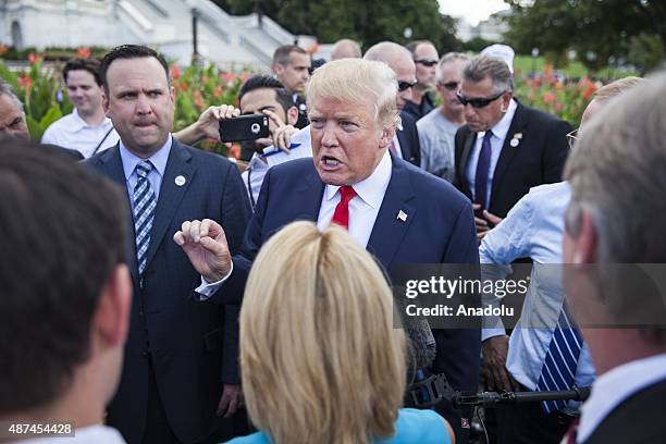 Candidate for the Republican Presidential nomination Donald Trump speaks to members of the media before speaking at a rally held by the Tea Party at...