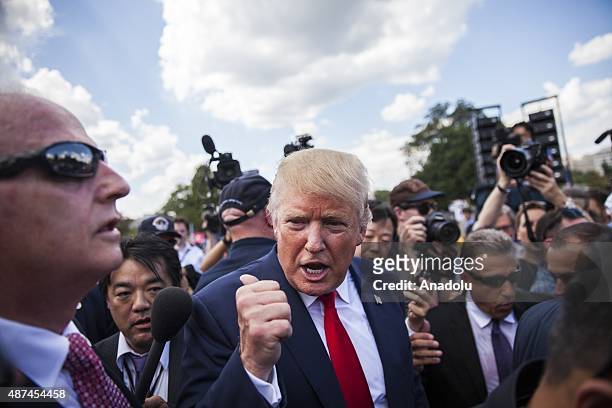 Candidate for the Republican Presidential nomination Donald Trump leaves after speaking at a rally held by the Tea Party at the United States Capitol...