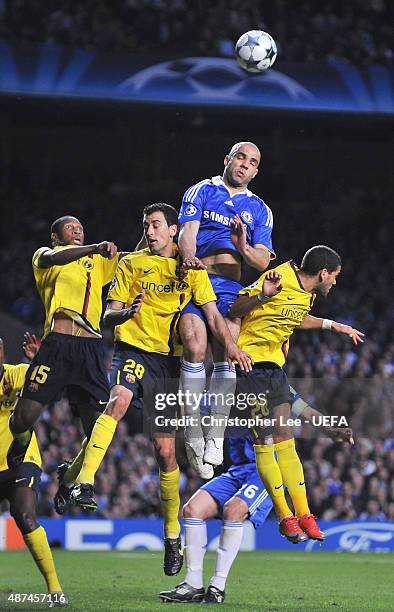 Alex of Chelsea heads clear under pressure during The UEFA Champions League Semi Final Second Leg match between Chelsea and Barcelona at Stamford...