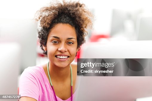 African American student using computer in a computer lab. African American student using computer in a computer lab.