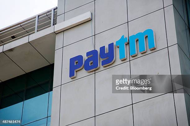Signage for Paytm is displayed at the One97 Communications Ltd. Headquarters in Noida, Uttar Pradesh, India, on Thursday, May 14, 2015. One97, which...