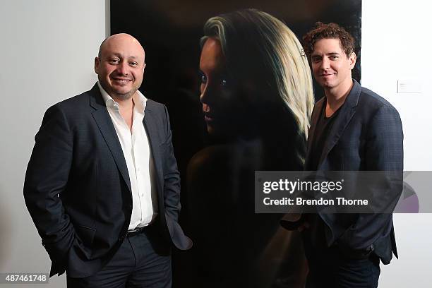 Larry Kestelman and Artist, Vincent Fantauzzo pose in front of his portrait unveiling of Charlize Theron on September 10, 2015 in Sydney, Australia.