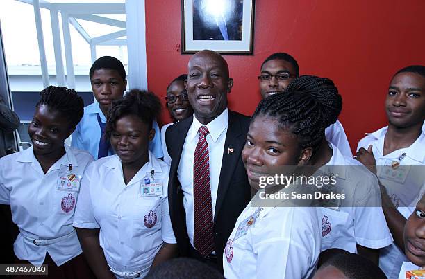 Keith Christopher Rowley , Prime Minister of Trinidad & Tobago, greets students of Bishop's High School at his swearing-in ceremony at Queen's Hall...