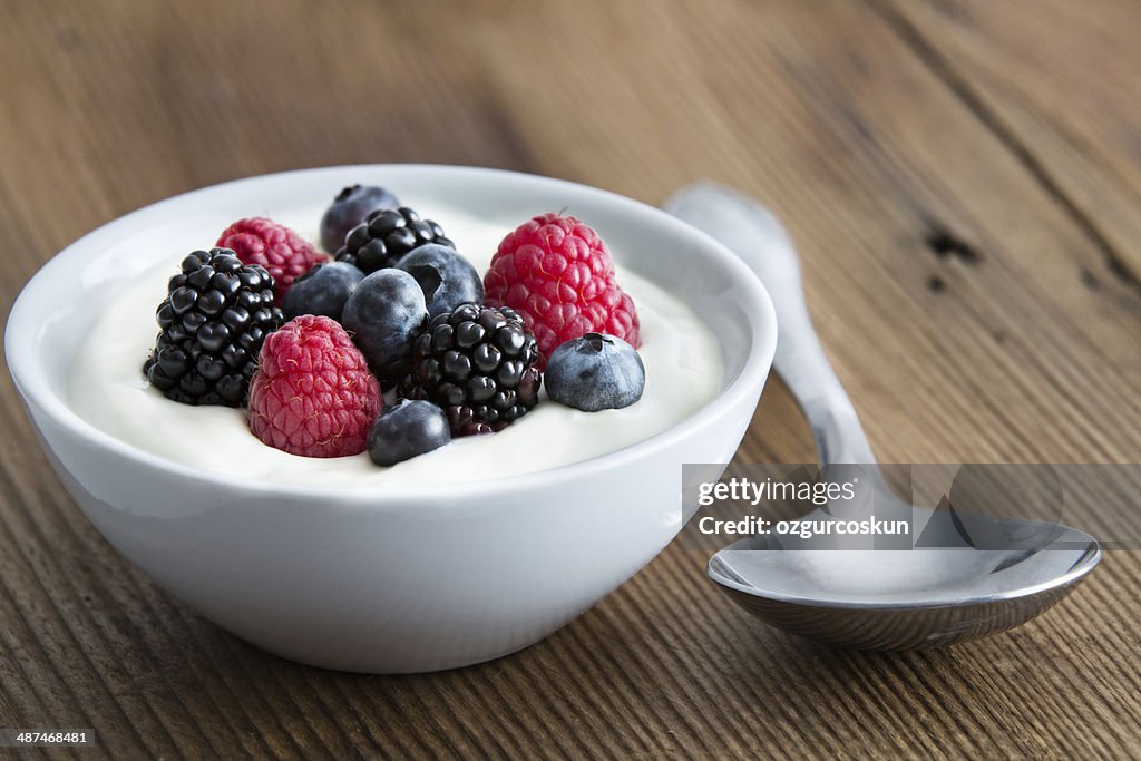 Bowl of fresh mixed berries and yogurt