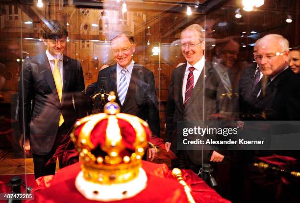 Prince Ernst August of Hanover, Prime Minister of the State of Lower Saxony Stephan Weil and mayor of Hanover Stefan Schostock stand in front of the...