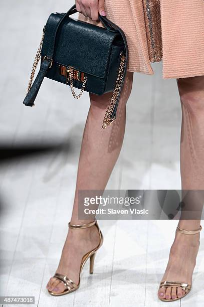 Model, purse detail, walks the runway at the LC Lauren Conrad fashion show during New York Fashion Week Spring 2016 at Skylight Modern on September...