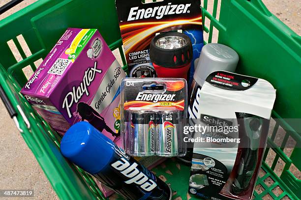 Energizer Holdings Inc. Products from its household products and personal-care units are arranged in a shopping basket for a photograph in a...