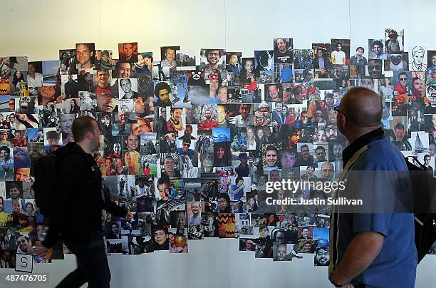 Attendees look at a wall of photos at the Facebook f8 conference on April 30, 2014 in San Francisco, California. Facebook CEO Mark Zuckerberg kicked...