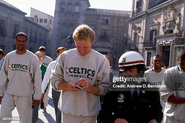 Larry Bird of the Boston Celtics walks to El Ayuntamiento, Madrid's City Hall to meet Mayor Juan Barranco during the 1988 McDonald's Championships on...