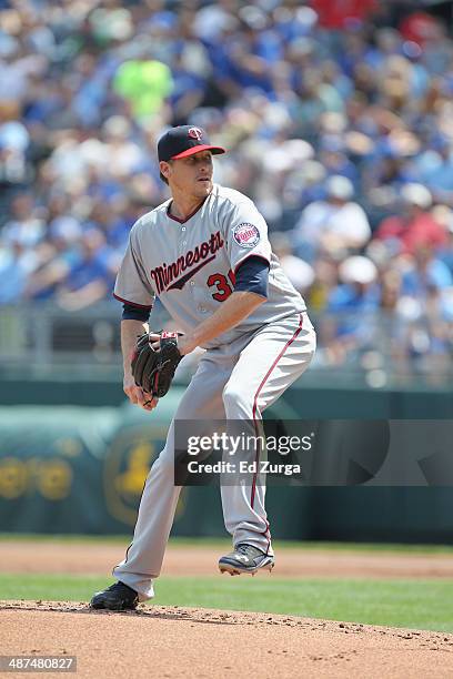 Kevin Correia of the Minnesota Twins throws against the Kansas City Royals at Kauffman Stadium on April 19, 2014 in Kansas City, Missouri.