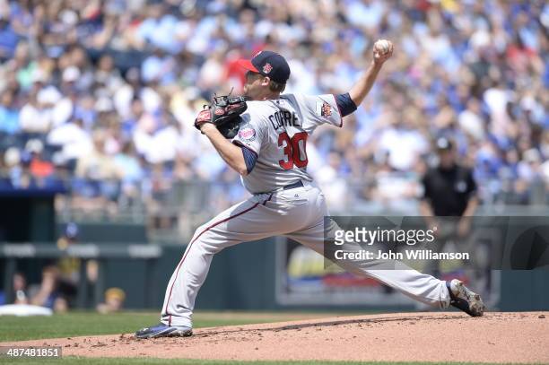 Kevin Correia of the Minnesota Twins pitches against the Kansas City Royals on April 19, 2014 at Kauffman Stadium in Kansas City, Missouri. The...