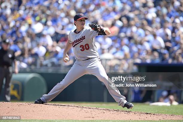 Kevin Correia of the Minnesota Twins pitches against the Kansas City Royals on April 19, 2014 at Kauffman Stadium in Kansas City, Missouri. The...