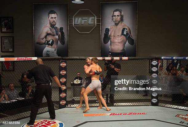 Vladimir Sikic pushes Abner Lloveras up against the cage during the elimination fights at the UFC TUF Gym on July 17, 2015 in Las Vegas, Nevada.