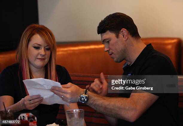 Radio personality Heather Collins and former mixed martial artist Forrest Griffin attend Touchdown for Charity's celebrity fantasy football draft at...