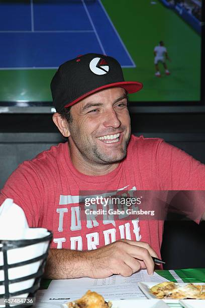 Rider and television host T.J. Lavin attends Touchdown for Charity's celebrity fantasy football draft at Born and Raised Tavern/Lounge on September...