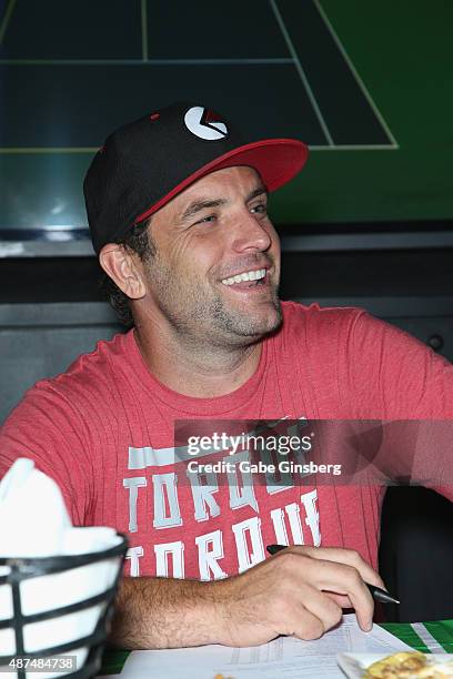 Rider and television host T.J. Lavin attends Touchdown for Charity's celebrity fantasy football draft at Born and Raised Tavern/Lounge on September...