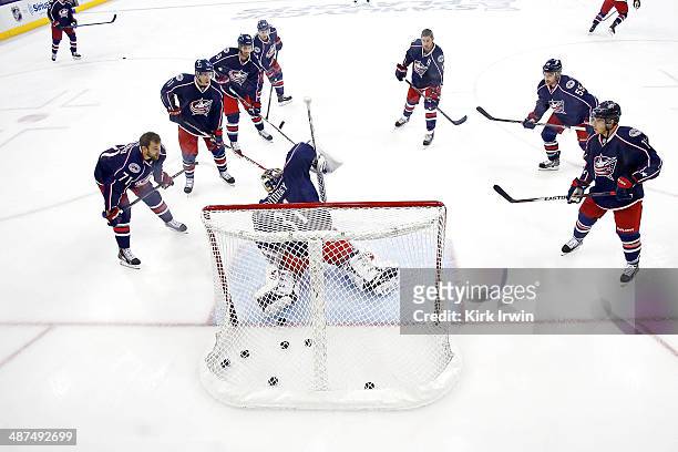 Curtis McElhinney of the Columbus Blue Jackets warms up prior to the start of Game Six of the First Round of the 2014 NHL Stanley Cup Playoffs...